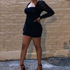 Ruched long sleeve black mini dress